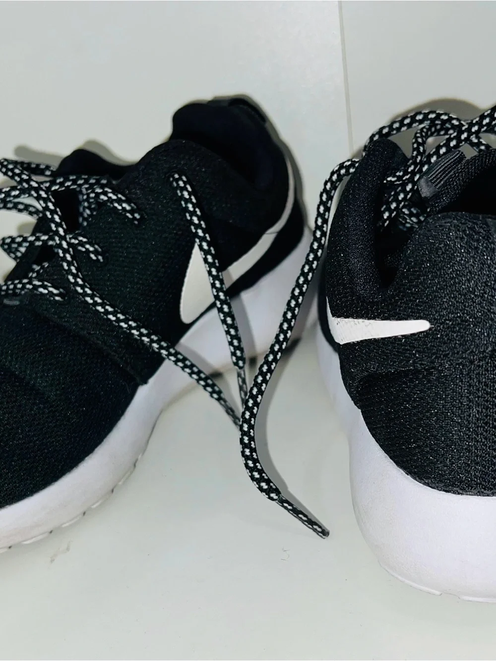 Nike Men’s Black Sneakers with White Swoosh and White Sole